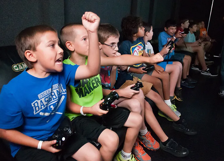 Children playing together inside the game truck