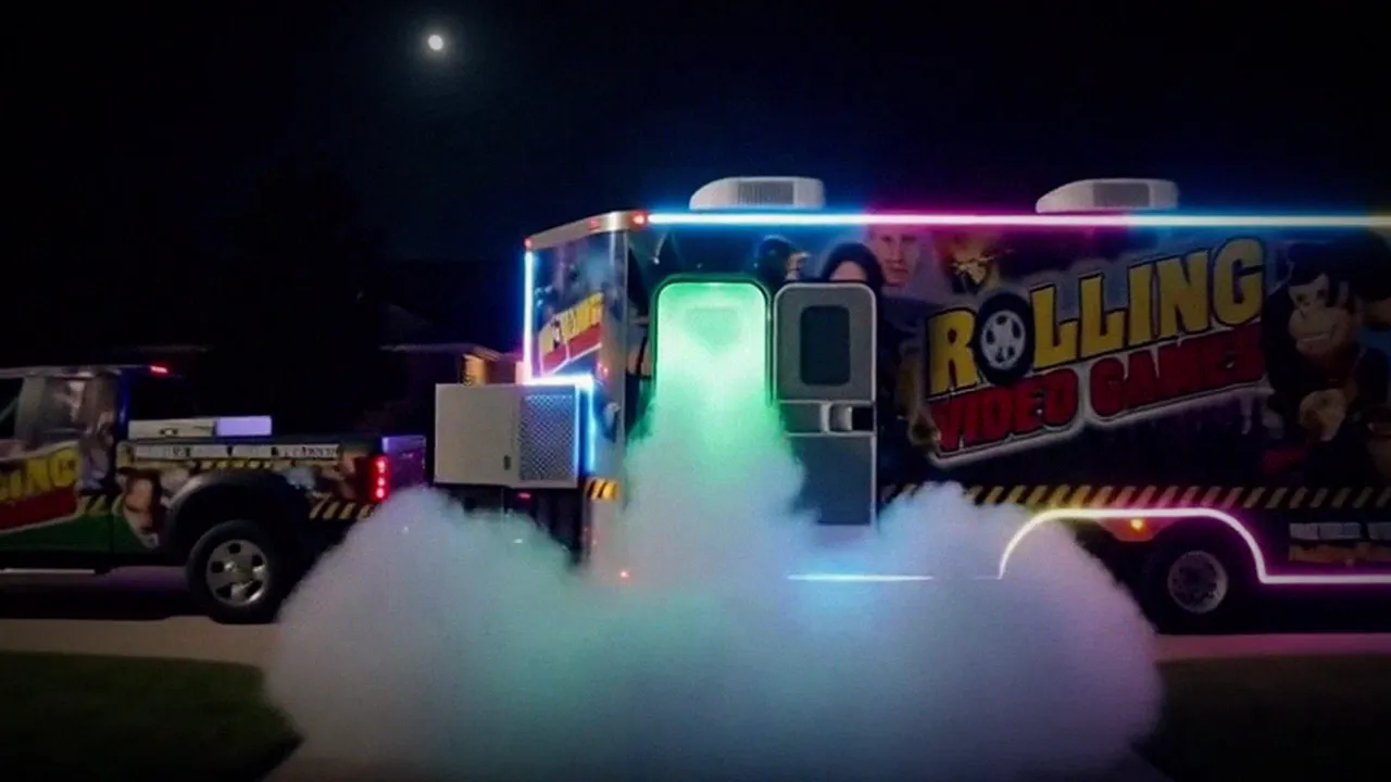 The game truck lighting up at night, with green fog pouring out of the open door